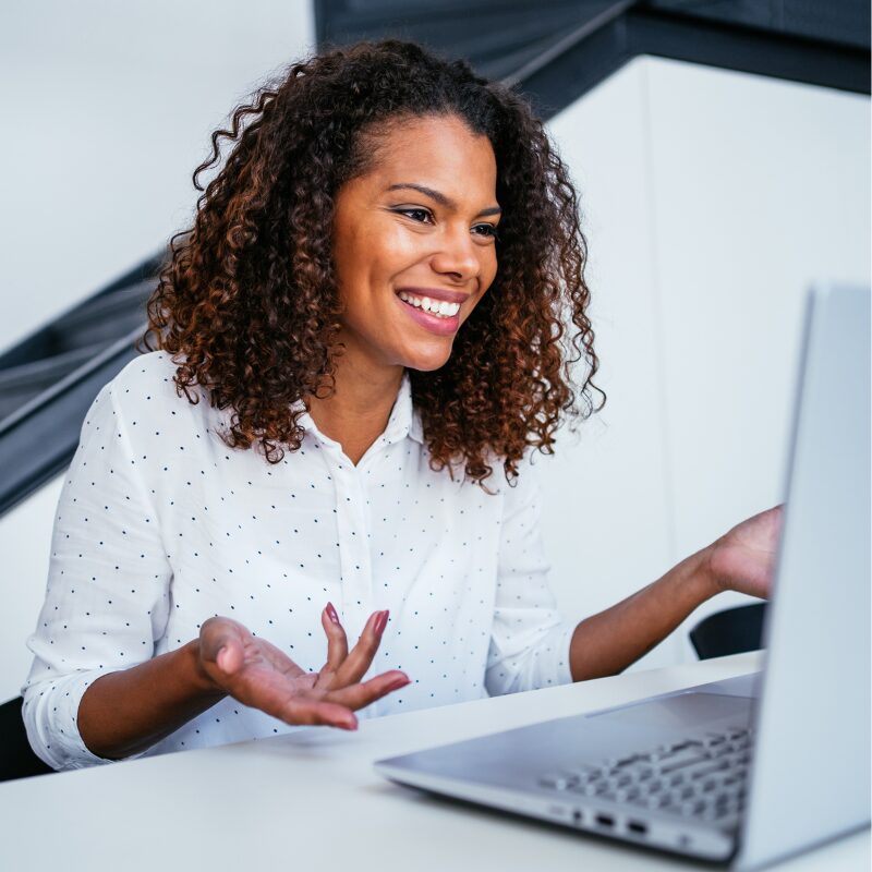 Smiling professional holding a certificate from E-learning Institute